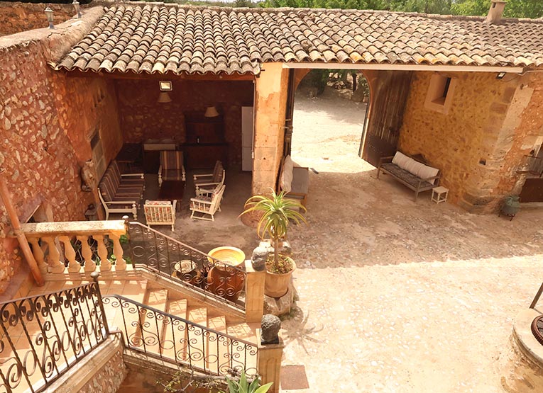 SEVERAL LOUNGING AREAS AND OUTSIDE COVERED DINING IN THE WALLED COURTYARD